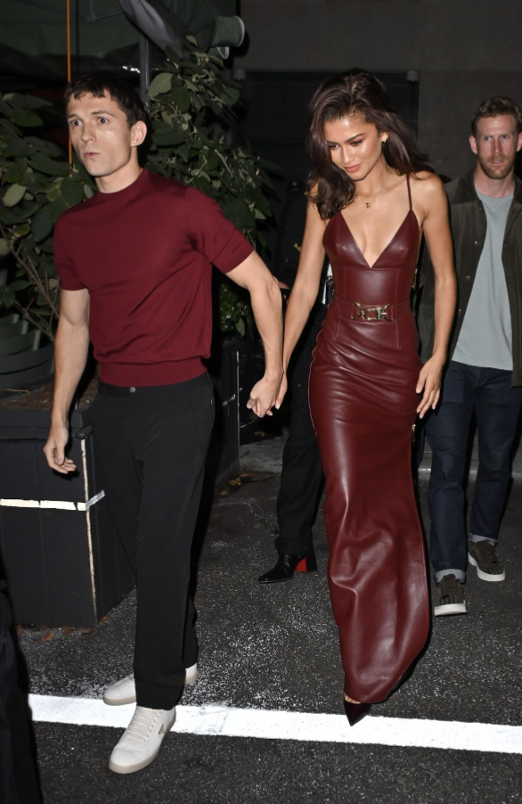 Actors Tom Holland and Zendaya as they walk into an event together. (Photo from British Vogue)